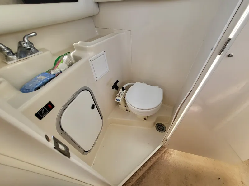 Slide: The Image of Bayliner 2859 Ciera Express 2000 boat bathroom with toilet and sink. - 6