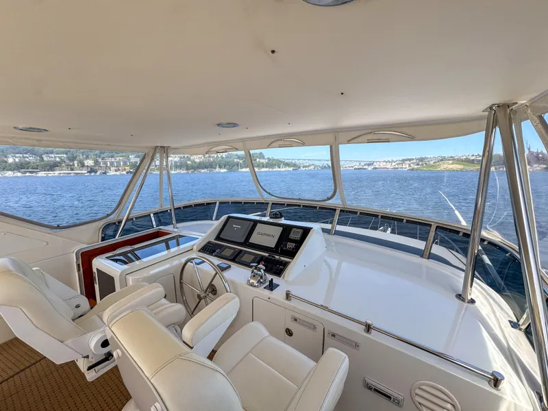 Slide: The Image of 2006 Ocean Alexander 58 Pilothouse yacht interior with helm station and panoramic water view. - 10
