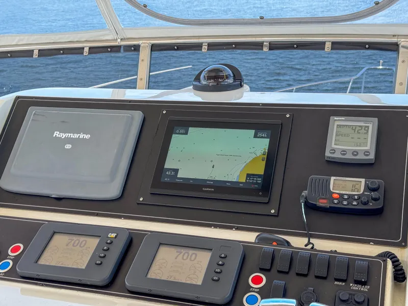 Slide: The Image of 2006 Ocean Alexander 58 Pilothouse navigation dashboard with Raymarine electronics and sea view. - 13