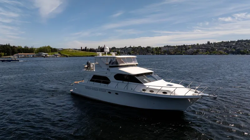 Slide: The Image of 2006 Ocean Alexander 58 Pilothouse yacht cruising on a sunny day. - 2