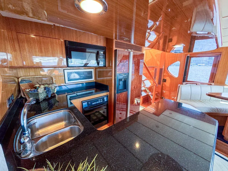 Slide: The Image of Luxurious kitchen area in a 2006 Ocean Alexander 58 Pilothouse yacht. - 27
