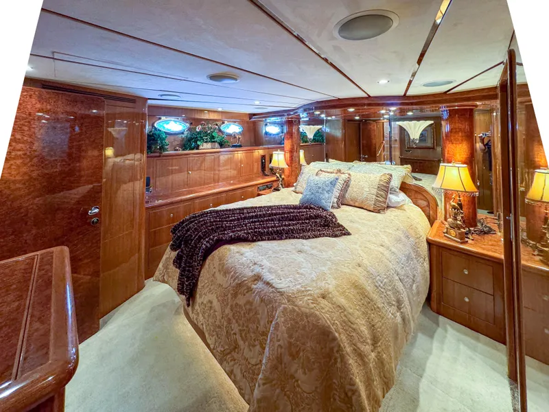 Slide: The Image of Luxurious bedroom interior of 2006 Ocean Alexander 58 Pilothouse yacht with elegant wood finishes. - 28