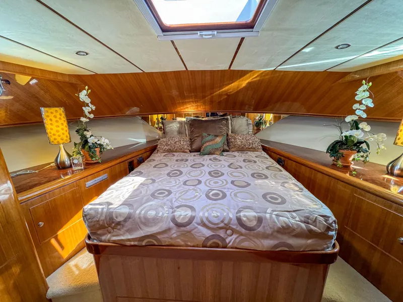 Slide: The Image of Luxurious bedroom in 2006 Ocean Alexander 58 Pilothouse yacht with skylight and elegant decor. - 31