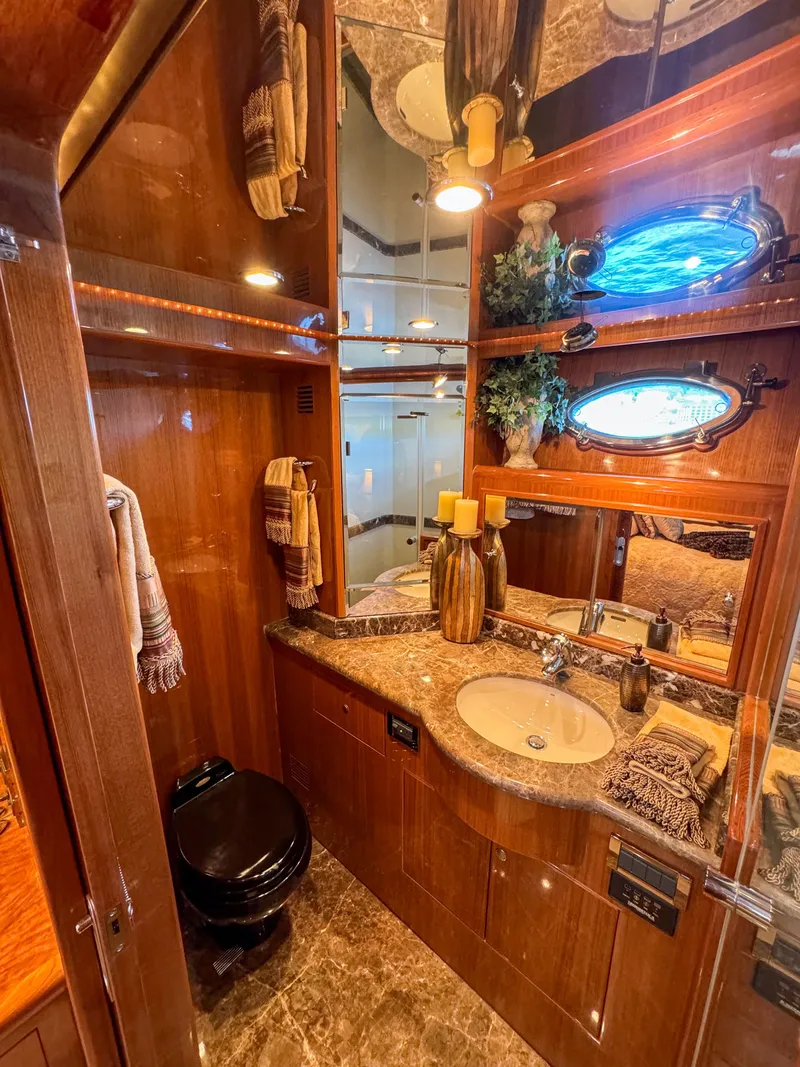 Slide: The Image of Luxurious bathroom in a 2006 Ocean Alexander 58 Pilothouse yacht with elegant wood finishes. - 36