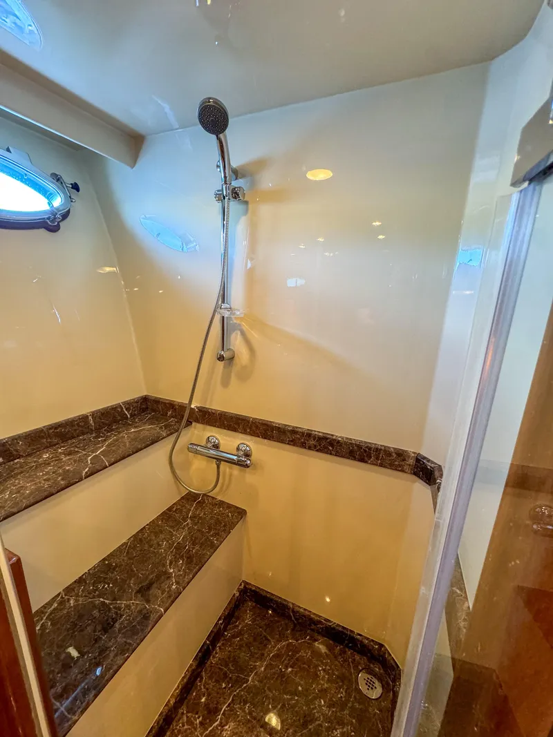 Slide: The Image of Luxurious shower in 2006 Ocean Alexander 58 Pilothouse yacht with marble accents. - 39