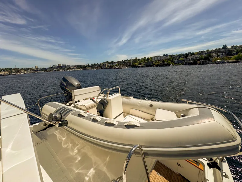 Slide: The Image of 2006 Ocean Alexander 58 Pilothouse yacht with inflatable tender on deck. - 44