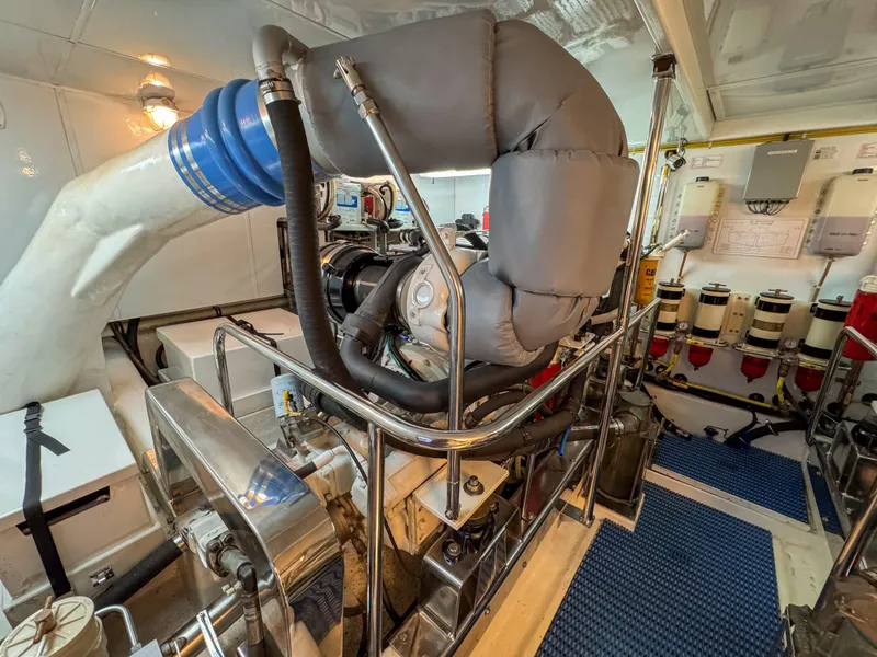 Slide: The Image of Engine room of a 2006 Ocean Alexander 58 Pilothouse yacht, showcasing machinery and equipment. - 46