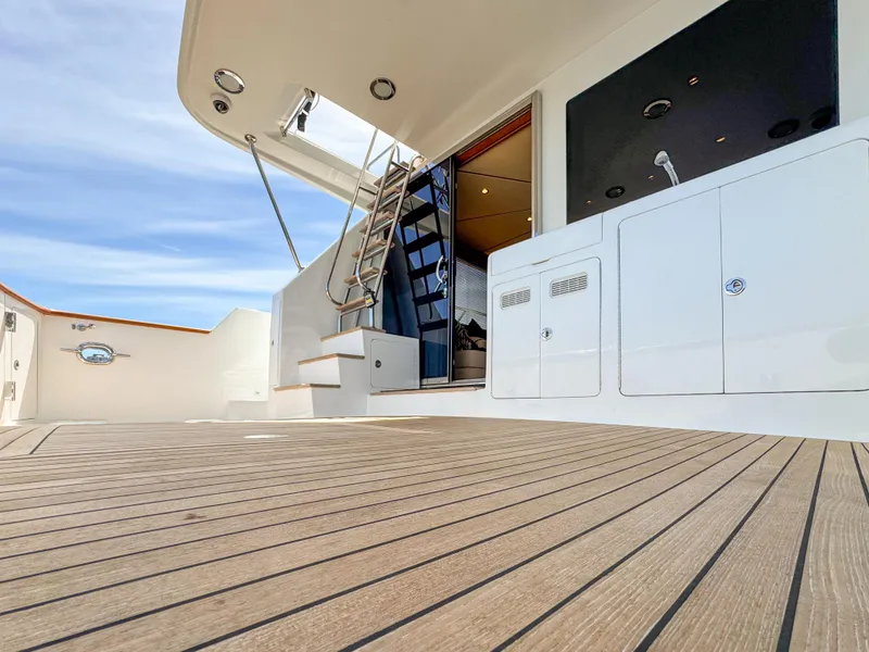 Slide: The Image of 2006 Ocean Alexander 58 Pilothouse yacht deck with stairs and storage compartments. - 8