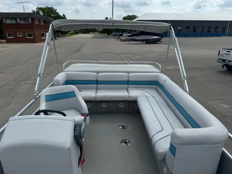 Slide: The Image of Pontoon boat interior with white and blue seating, Harris 200 Classic, 1993 model. - 6
