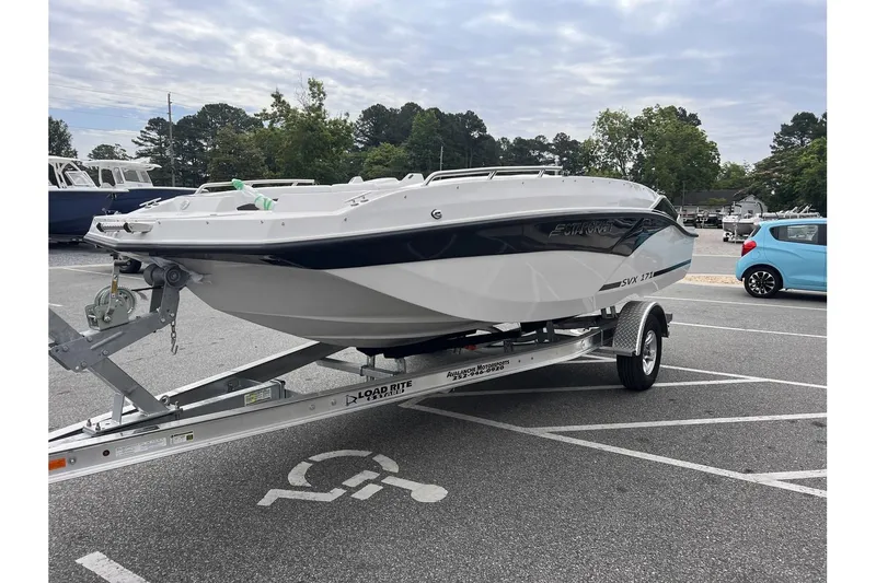 Slide: The Image of 2024 Starcraft SVX 171 OB boat on a trailer in a parking lot. - 6