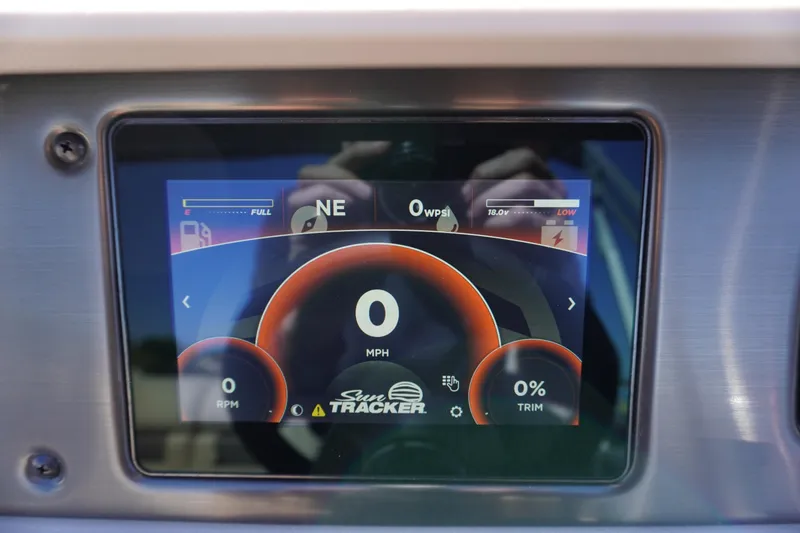 Slide: The Image of 2024 Sun Tracker Party Barge 20 DLX digital dashboard display showing speed and fuel levels. - 10