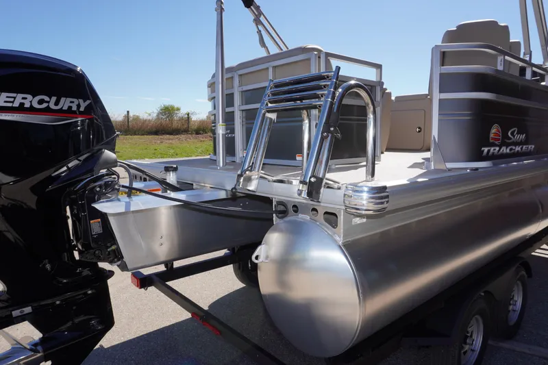 Slide: The Image of 2024 Sun Tracker Party Barge 20 DLX pontoon boat with Mercury engine, rear view. - 15