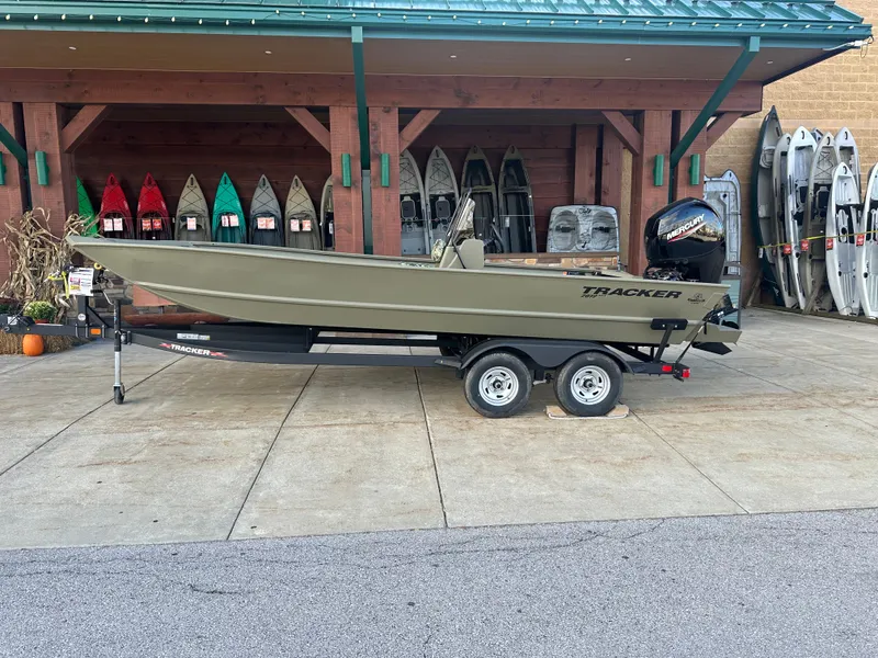 The Image of 2024 Tracker Grizzly 2072 CC boat on trailer, displayed outdoors. - 0
