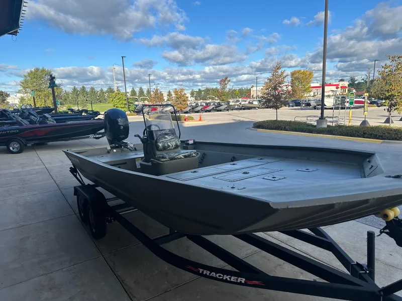 Slide: The Image of 2024 Tracker Grizzly 2072 CC boat on trailer, outdoor dealership display. - 2