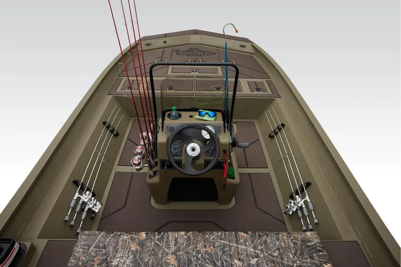 Slide: The Image of 2024 Tracker Grizzly 2072 CC boat interior with fishing rods and steering console. - 8