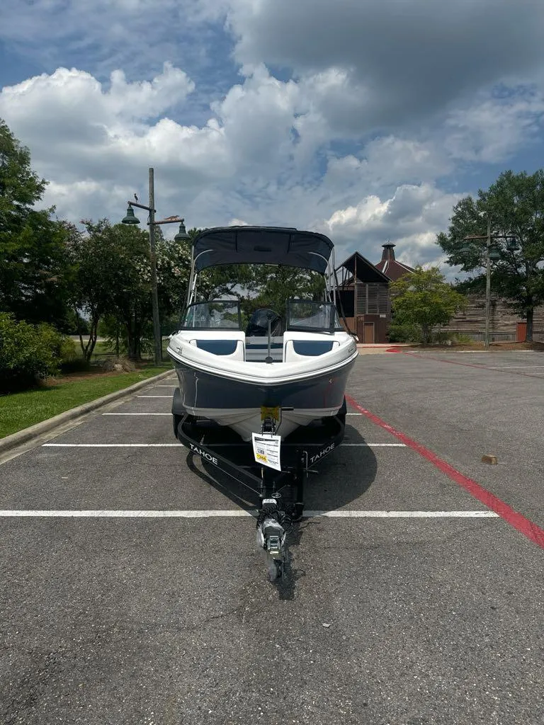 Slide: The Image of 2024 Tahoe 185 S boat parked in a lot on a sunny day. - 3