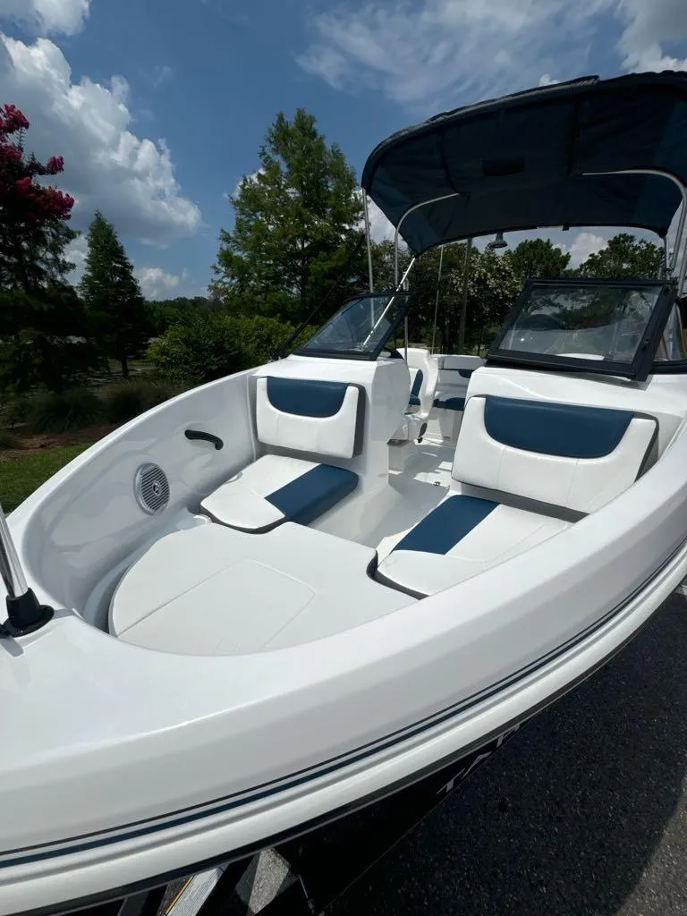 Slide: The Image of 2024 Tahoe 185 S boat with blue and white seating. - 4