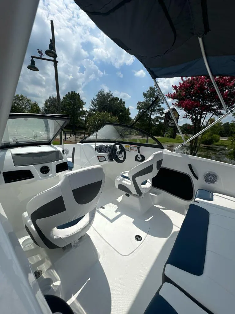 Slide: The Image of 2024 Tahoe 185 S boat interior with seating and steering wheel. - 5