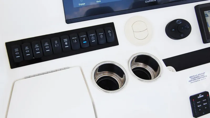 Slide: The Image of Control panel and cup holders on a 2019 Regulator 41 boat. - 13