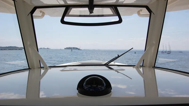 Slide: The Image of View from the helm of a 2019 Regulator 41 boat on the water. - 16