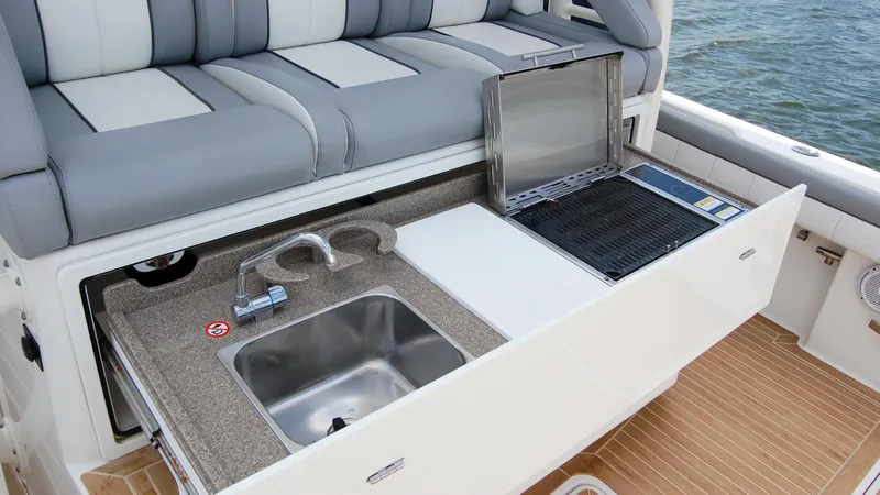 Slide: The Image of 2019 Regulator 41 boat with outdoor sink and grill station. - 17