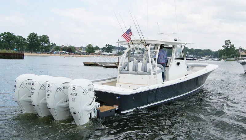 Slide: The Image of 2019 Regulator 41 boat with four Yamaha 425 engines on the water. - 2