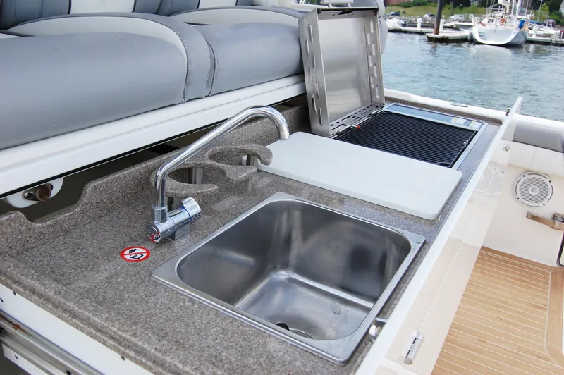 Slide: The Image of 2019 Regulator 41 boat with outdoor sink and grill station. - 20