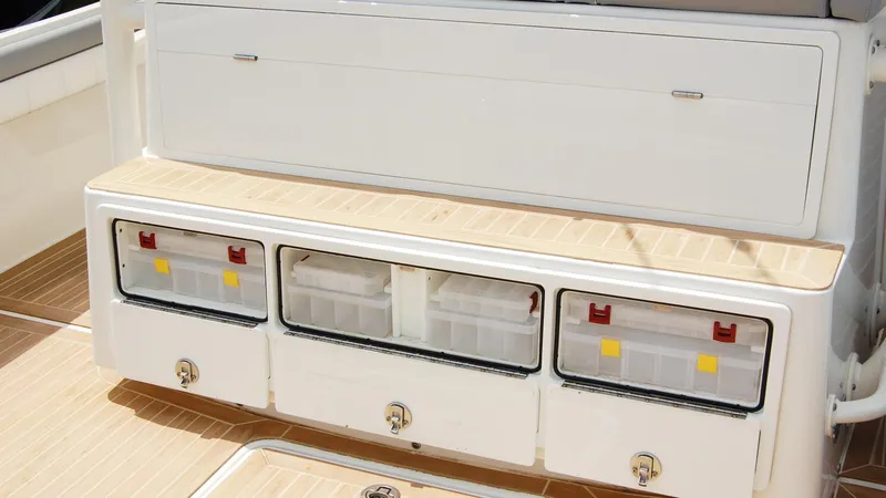 Slide: The Image of 2019 Regulator 41 boat storage compartments and tackle boxes. - 26