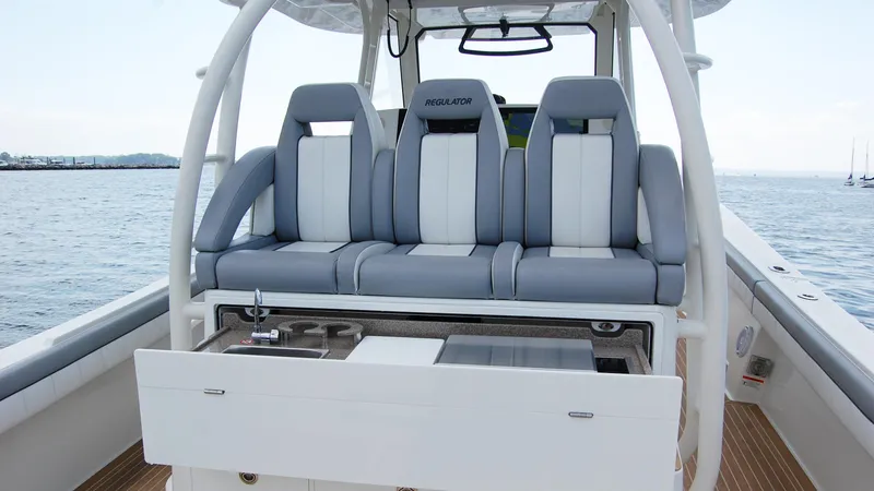 Slide: The Image of 2019 Regulator 41 boat with cushioned seating and storage on deck. - 3