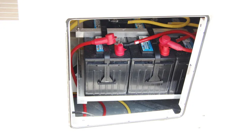 Slide: The Image of Battery compartment of 2019 Regulator 41 boat with connected cables. - 31