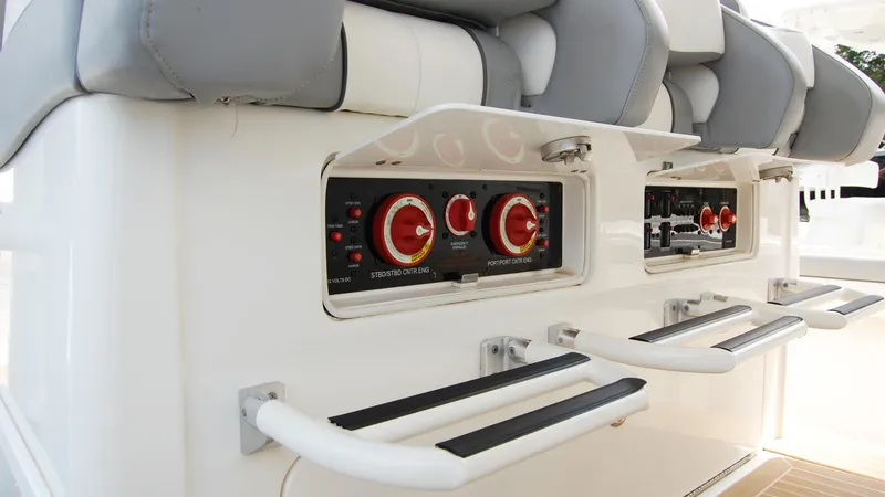Slide: The Image of Control panel and seating area of a 2019 Regulator 41 boat. - 33