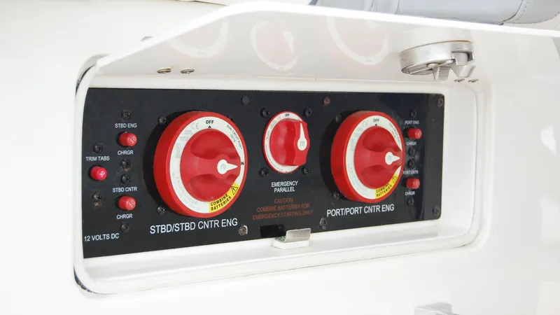 Slide: The Image of Control panel of a 2019 Regulator 41 boat with engine switches and emergency parallel. - 34