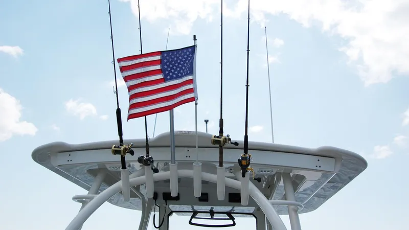 Slide: The Image of 2019 Regulator 41 boat with American flag and fishing rods. - 4