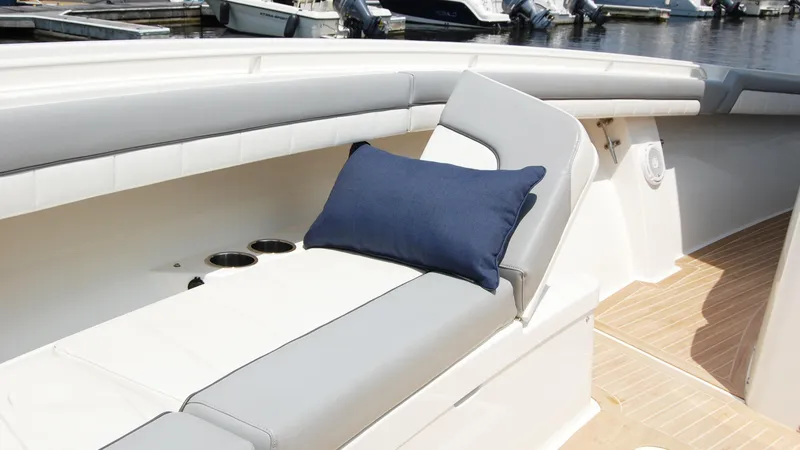 Slide: The Image of Luxurious seating area on a 2019 Regulator 41 boat with a blue cushion. - 40