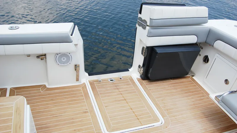 Slide: The Image of 2019 Regulator 41 boat deck with cushioned seating and teak flooring. - 45
