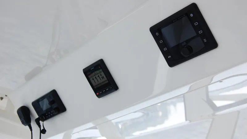 Slide: The Image of 2019 Regulator 41 boat dashboard with electronic controls and communication devices. - 9