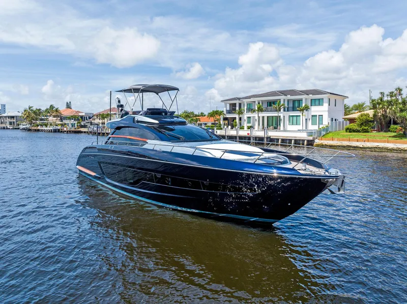 The Image of 2020 Riva 66' Ribelle luxury yacht cruising on a sunny day. - 0