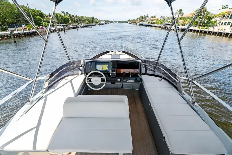 Slide: The Image of 2020 Riva 66' Ribelle yacht cockpit with modern navigation system and spacious seating. - 12