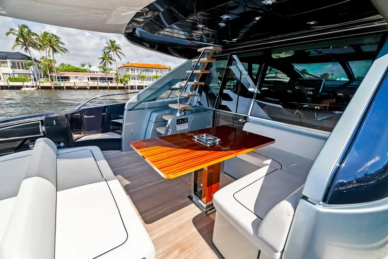 Slide: The Image of Luxurious 2020 Riva 66' Ribelle yacht with elegant outdoor seating and dining area. - 21