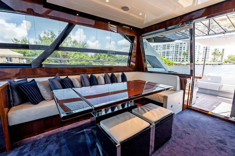 Slide: The Image of Luxurious interior of 2020 Riva 66' Ribelle yacht with plush seating and large windows. - 22