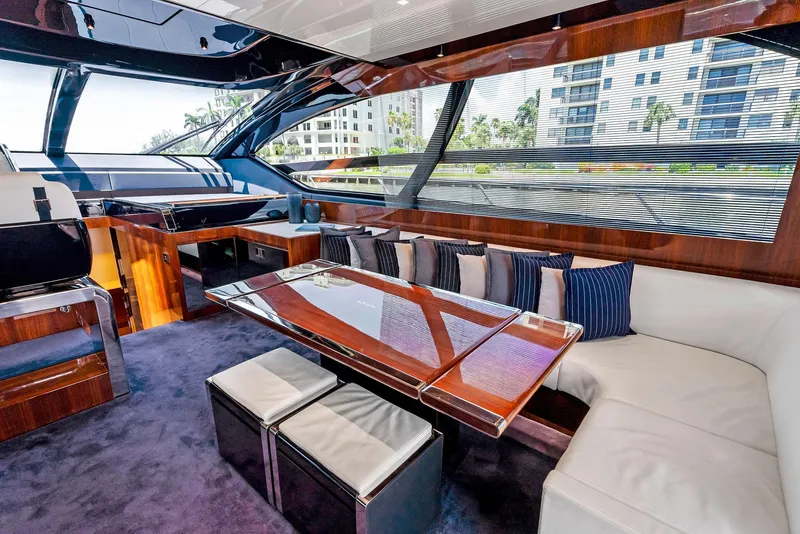 Slide: The Image of Luxurious interior of a 2020 Riva 66' Ribelle yacht with plush seating and modern design. - 24