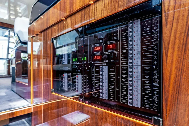 Slide: The Image of Control panel of a 2020 Riva 66' Ribelle yacht with wooden finish. - 28