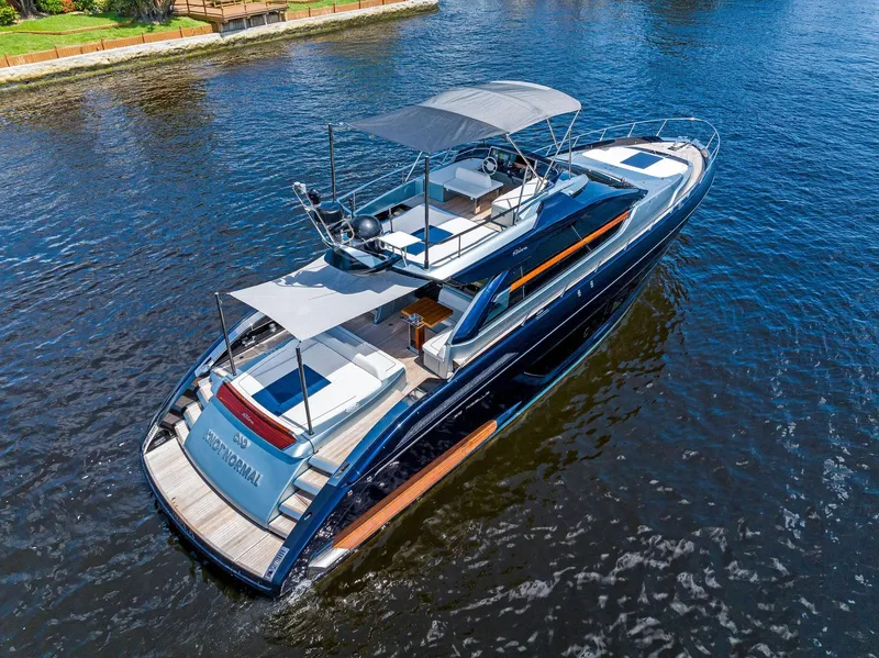 Slide: The Image of 2020 Riva 66' Ribelle luxury yacht cruising on a calm river. - 3