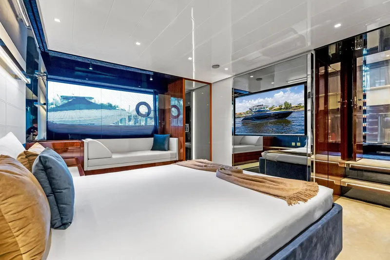 Slide: The Image of Luxurious bedroom interior of 2020 Riva 66' Ribelle yacht with modern decor and large windows. - 30