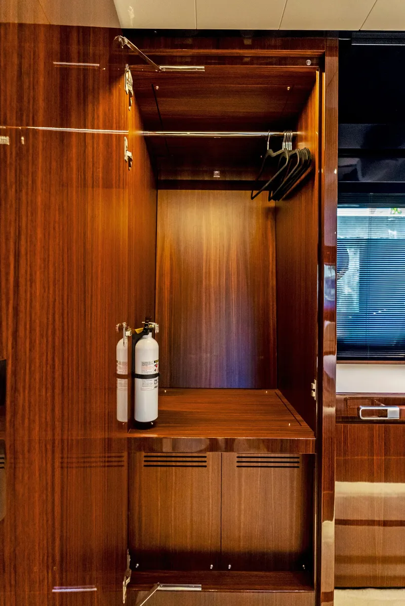 Slide: The Image of Luxurious wooden closet interior on a 2020 Riva 66' Ribelle yacht. - 33
