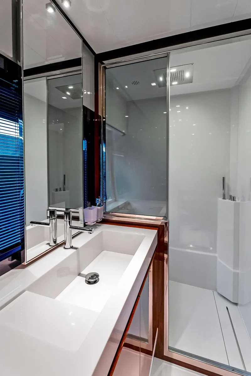 Slide: The Image of Modern bathroom in 2020 Riva 66' Ribelle yacht with sleek fixtures and glass shower. - 35