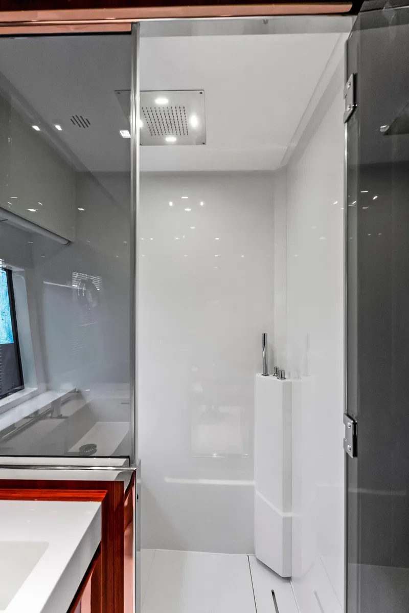 Slide: The Image of Modern bathroom on a 2020 Riva 66' Ribelle yacht with glass shower enclosure. - 36