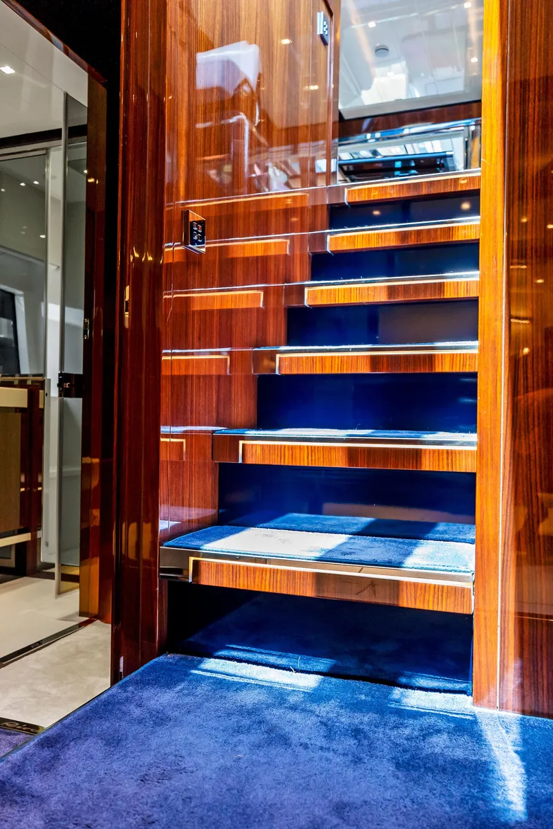 Slide: The Image of Luxurious wooden staircase inside 2020 Riva 66' Ribelle yacht. - 41