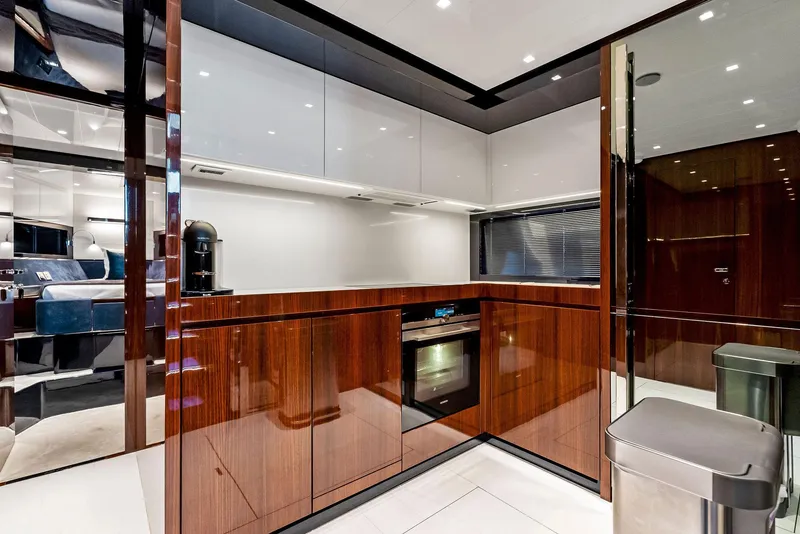 Slide: The Image of Modern kitchen interior on a 2020 Riva 66' Ribelle yacht with sleek cabinetry. - 46