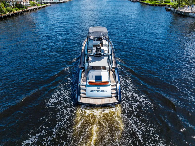 Slide: The Image of Aerial view of 2020 Riva 66' Ribelle luxury yacht cruising on a waterway. - 7